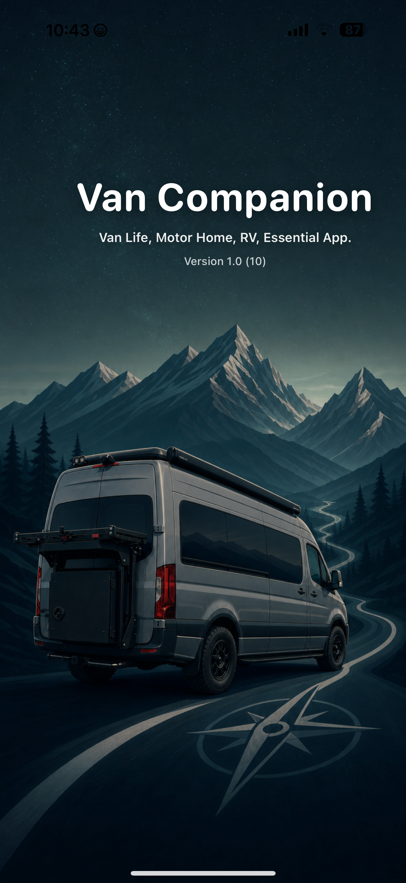 Van Companion app launch screen with a camper van, mountain road, and compass